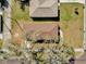 Overhead view of a house and its surroundings, showcasing the brown roof, landscaping, and neighborhood layout at 901 S Holly Ave, Sanford, FL 32771