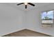 Bedroom featuring new flooring, a window, and a ceiling fan at 901 S Holly Ave, Sanford, FL 32771