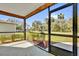 View from the screened-in porch highlighting the outdoor space and neighborhood views at 901 S Holly Ave, Sanford, FL 32771