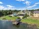 Exterior view of a condo featuring a beautiful waterfront location, patio, and community pool at 942 Lake Destiny Rd # B, Altamonte Springs, FL 32714