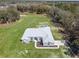 Aerial view of the beautiful home with a spacious yard and lush greenery at 10688 Sw 129Th Terrace Rd, Dunnellon, FL 34432