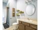 Bright bathroom featuring a modern vanity, stylish fixtures, and a walk-in shower at 10688 Sw 129Th Terrace Rd, Dunnellon, FL 34432