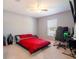 Vibrant bedroom featuring a unique bed frame, a window, and ample space for relaxation at 10688 Sw 129Th Terrace Rd, Dunnellon, FL 34432