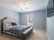 Well-lit bedroom featuring a comfortable bed, neutral tones, and a window at 10688 Sw 129Th Terrace Rd, Dunnellon, FL 34432