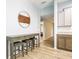 Stylish breakfast nook with a counter height table, three stools, and great transition to the kitchen at 10688 Sw 129Th Terrace Rd, Dunnellon, FL 34432