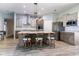 Gourmet kitchen featuring a large island with barstool seating and stainless steel appliances at 10688 Sw 129Th Terrace Rd, Dunnellon, FL 34432