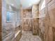 Walk-in shower detailed with elegant tile and a window at 10688 Sw 129Th Terrace Rd, Dunnellon, FL 34432