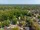 Home aerial view showing surrounding lush landscape, neighborhood, and natural beauty at 113 Wheatland Ct, Longwood, FL 32779