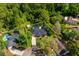 Aerial view of the property with lush landscaping and privacy at 113 Wheatland Ct, Longwood, FL 32779