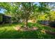 Beautiful backyard with lush green grass, mature trees, and established landscaping, providing a serene outdoor space at 113 Wheatland Ct, Longwood, FL 32779