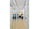 Hallway with closet featuring mirrored doors at 113 Wheatland Ct, Longwood, FL 32779