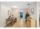 Hallway features tile floors, neutral paint, and a blue door at 113 Wheatland Ct, Longwood, FL 32779