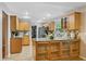 Large kitchen with granite countertops, stainless steel appliances, and convenient center island at 113 Wheatland Ct, Longwood, FL 32779