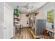 Spacious laundry room with modern washer and dryer, storage shelving, and durable wood-look flooring at 113 Wheatland Ct, Longwood, FL 32779