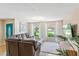 Comfortable living room with a large sectional sofa, bright windows, and modern decor at 113 Wheatland Ct, Longwood, FL 32779