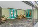 Covered patio with tiled flooring, stylish patio furniture and easy access to the pool area via glass doors at 113 Wheatland Ct, Longwood, FL 32779