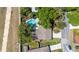 Aerial view of home featuring a private pool surrounded by lush trees and landscaping at 116 Cambridge Dr, Longwood, FL 32779