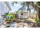 Backyard view of a shed with a gate and a garden hose at 116 Cambridge Dr, Longwood, FL 32779