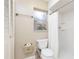 Bathroom featuring a toilet, white shower, and a small window at 116 Cambridge Dr, Longwood, FL 32779