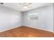Bedroom with laminate flooring, light walls, and natural light from a window at 116 Cambridge Dr, Longwood, FL 32779