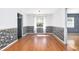 Dining room featuring light walls, laminate flooring, natural light from a window, and dark patterned wall decor at 116 Cambridge Dr, Longwood, FL 32779