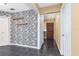 Open foyer with tile floors and a view of the front door, opening to a second room at 116 Cambridge Dr, Longwood, FL 32779