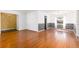 Open living room featuring laminate flooring, light walls, and natural light from a window at 116 Cambridge Dr, Longwood, FL 32779