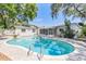 Backyard view of a sparkling swimming pool with patio and landscaping at 116 Cambridge Dr, Longwood, FL 32779