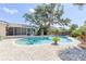 Spacious backyard showcasing a sparkling in-ground pool and a paver patio at 116 Cambridge Dr, Longwood, FL 32779