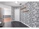Interior room with decorative accent wall, black tile floors, white trim and wooden shelves at 116 Cambridge Dr, Longwood, FL 32779