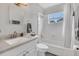 Bright bathroom with combination tub and shower, and vanity at 119 Mayfair Cir, Sanford, FL 32771