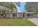 Charming single-story home with a well-maintained lawn and inviting front porch at 119 Mayfair Cir, Sanford, FL 32771