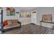 Cozy living area with wood floors and barstool seating open to the kitchen at 119 Mayfair Cir, Sanford, FL 32771