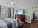 Bright bedroom with wood floors and a ceiling fan at 1228 Walker S Cir, Lakeland, FL 33805