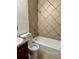 Tiled bathroom featuring a shower-tub combination and a modern vanity at 1352 Sw 69Th Rd, Bushnell, FL 33513