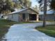 Cozy single-story home with a gravel driveway and well-maintained front yard at 1352 Sw 69Th Rd, Bushnell, FL 33513