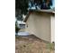 Exterior view of the home with neutral siding and a concrete patio and grass yard at 1352 Sw 69Th Rd, Bushnell, FL 33513