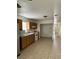 Traditional eat-in kitchen features oak cabinetry, white appliances, and tile flooring at 1352 Sw 69Th Rd, Bushnell, FL 33513