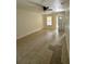 Open-concept living area with tile floors, ceiling fan, and natural light from a nearby door at 1352 Sw 69Th Rd, Bushnell, FL 33513