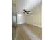 Spacious living room with tile flooring and a modern ceiling fan, illuminated by natural light at 1352 Sw 69Th Rd, Bushnell, FL 33513