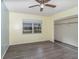 Bedroom features wood-look vinyl floors, a window and closet at 1417 High Point Blvd # 150D, Orlando, FL 32825