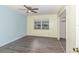 Bright bedroom features vinyl floors, blue accent wall, and a ceiling fan at 1417 High Point Blvd # 150D, Orlando, FL 32825