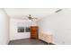 Bedroom features wood-look vinyl floors, a window, ceiling fan, and dressers at 1417 High Point Blvd # 150D, Orlando, FL 32825