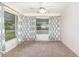 Bright room with carpet and curtains at 1417 High Point Blvd # 150D, Orlando, FL 32825