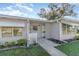 Inviting front entrance with decorative concrete blocks, landscaping, and a well-kept walkway at 1417 High Point Blvd # 150D, Orlando, FL 32825