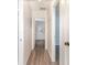 A hallway stretches into the distance with multiple doorways, creating a sense of depth and connectivity at 1417 High Point Blvd # 150D, Orlando, FL 32825