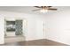 Spacious living room with a ceiling fan and doorway to a carpeted room at 1417 High Point Blvd # 150D, Orlando, FL 32825