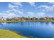 Scenic view of the community pond and fountain with lush green landscaping at 1417 High Point Blvd # 150D, Orlando, FL 32825