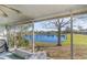 Enjoy the serene lake view from this screened porch, perfect for relaxing and entertaining guests at 1417 High Point Blvd # 150D, Orlando, FL 32825