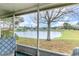 Enjoy serene water views from this relaxing screened porch, with lush greenery and a tranquil fountain at 1417 High Point Blvd # 150D, Orlando, FL 32825